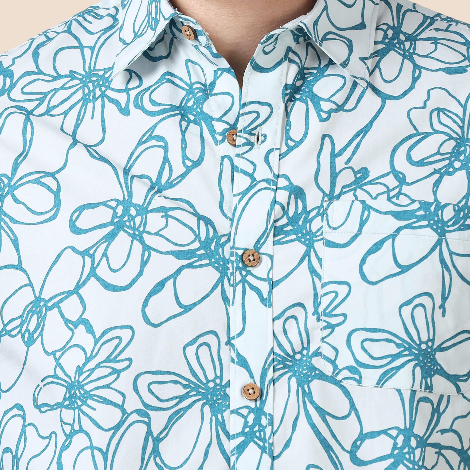 Ashley Cotton Half Sleeves Shirt In Teal Floral Print Teal floral shirt paired with chinos by TFC