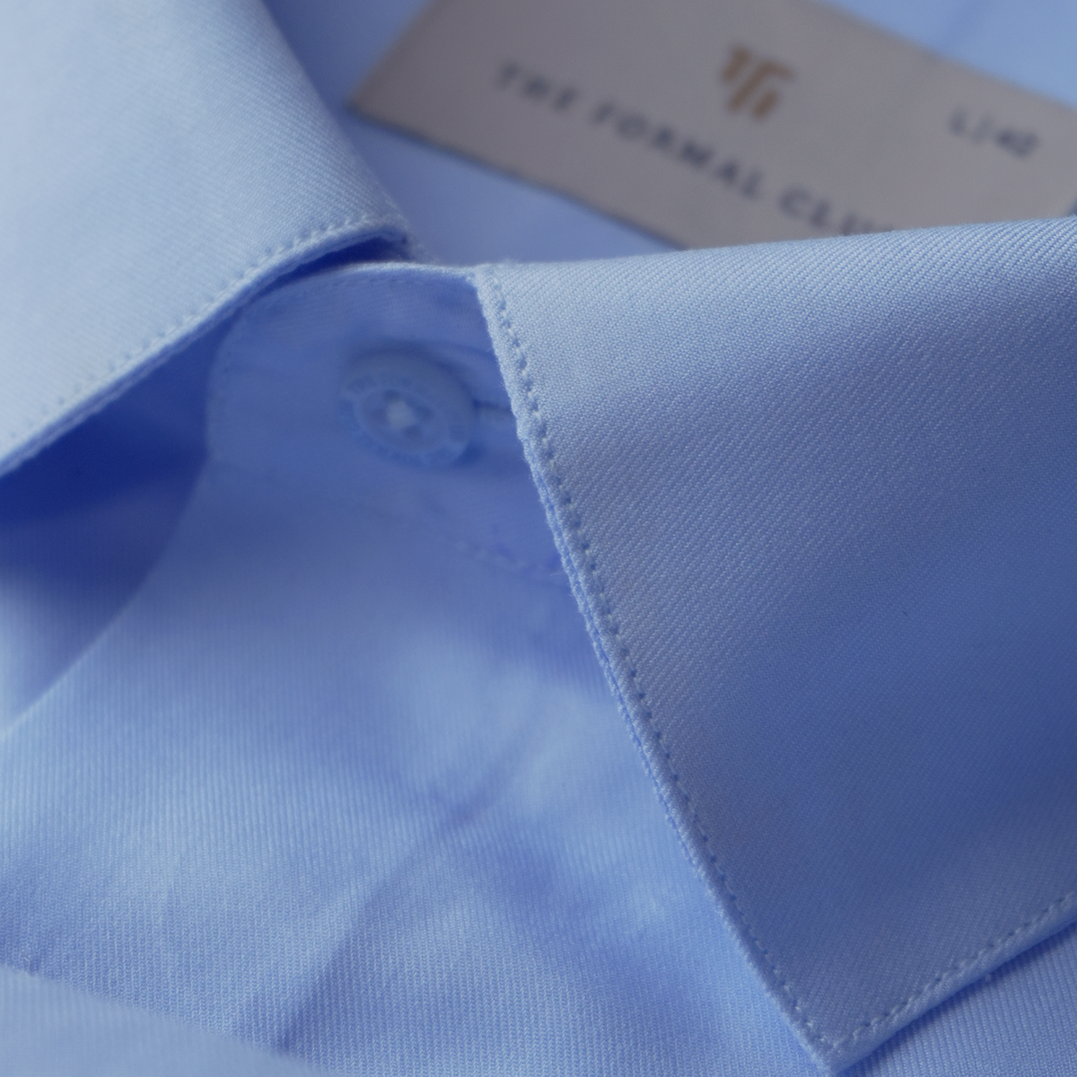Close-up of a blue formal shirt collar